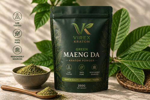 Virex Kratom package with green maeng da kratom powder on a wooden surface with leaves in the background